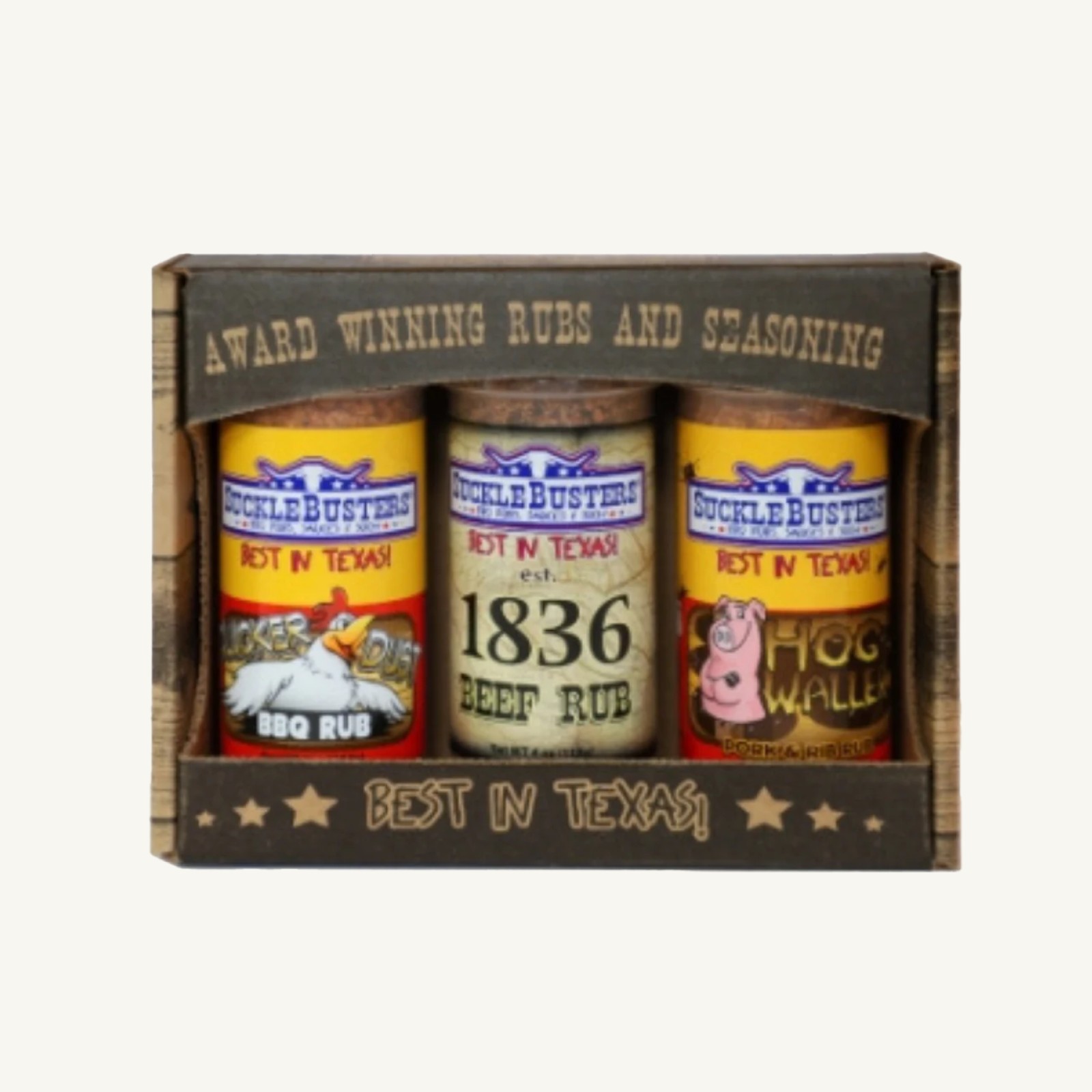 Three bottles of SuckleBusters seasoning in a decorative box on a white background