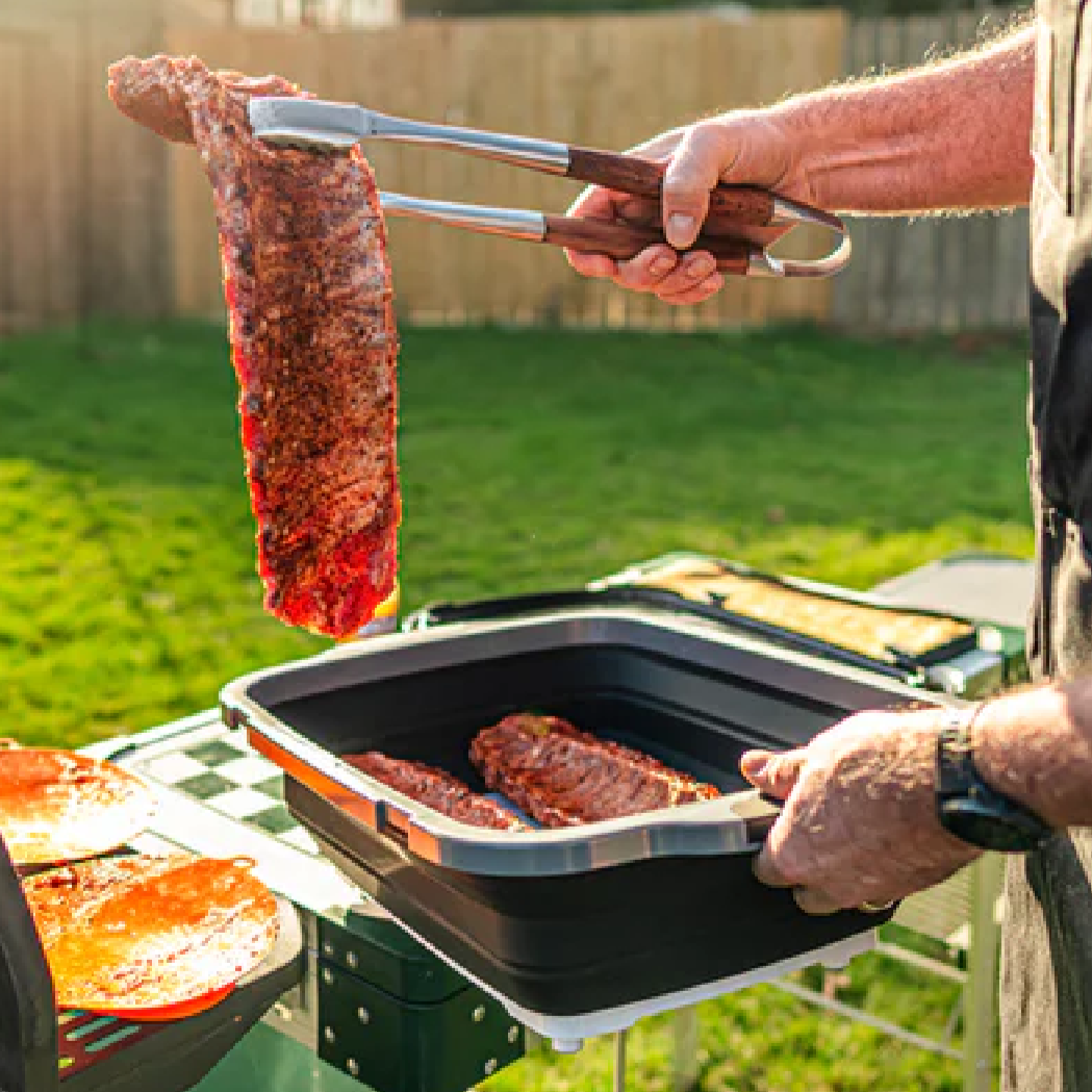 Meat moving from prep tub to grill