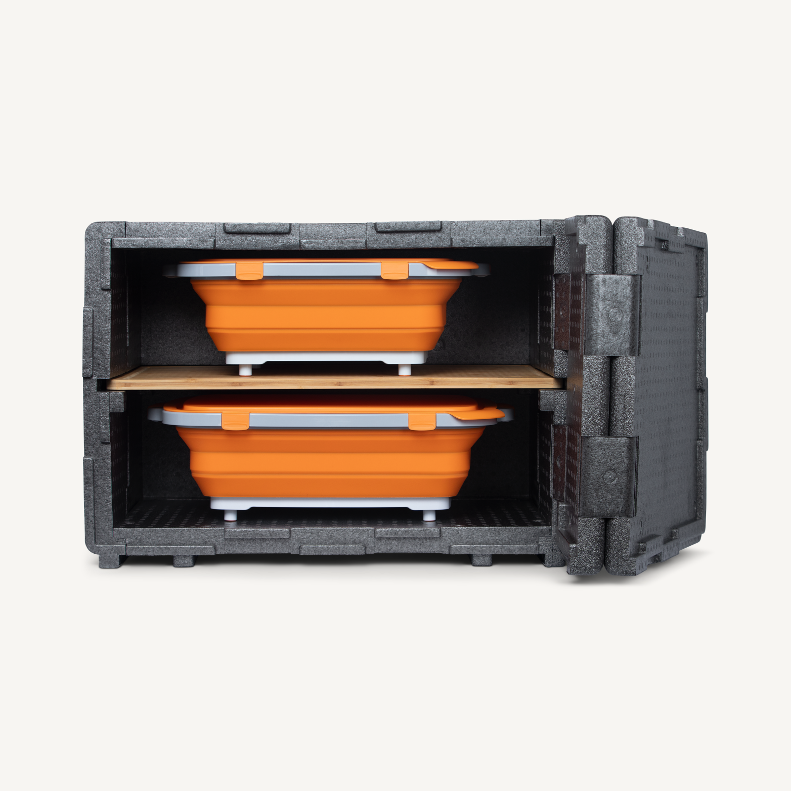 Orange collapsible containers stacked inside a gray storage case on a white background